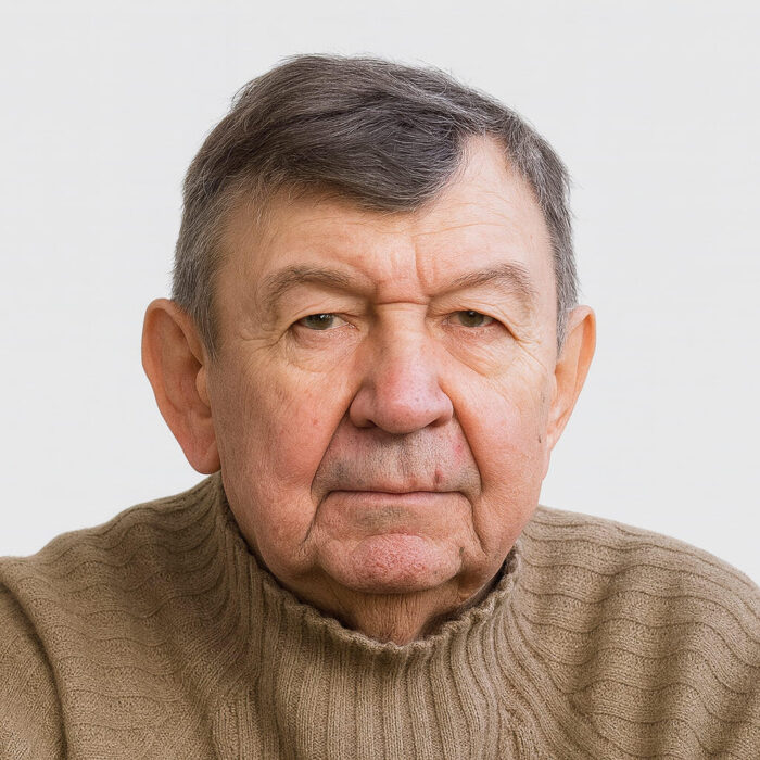 Портрет на замислен възрастен мъж с дълбоки очи и мъдри черти.